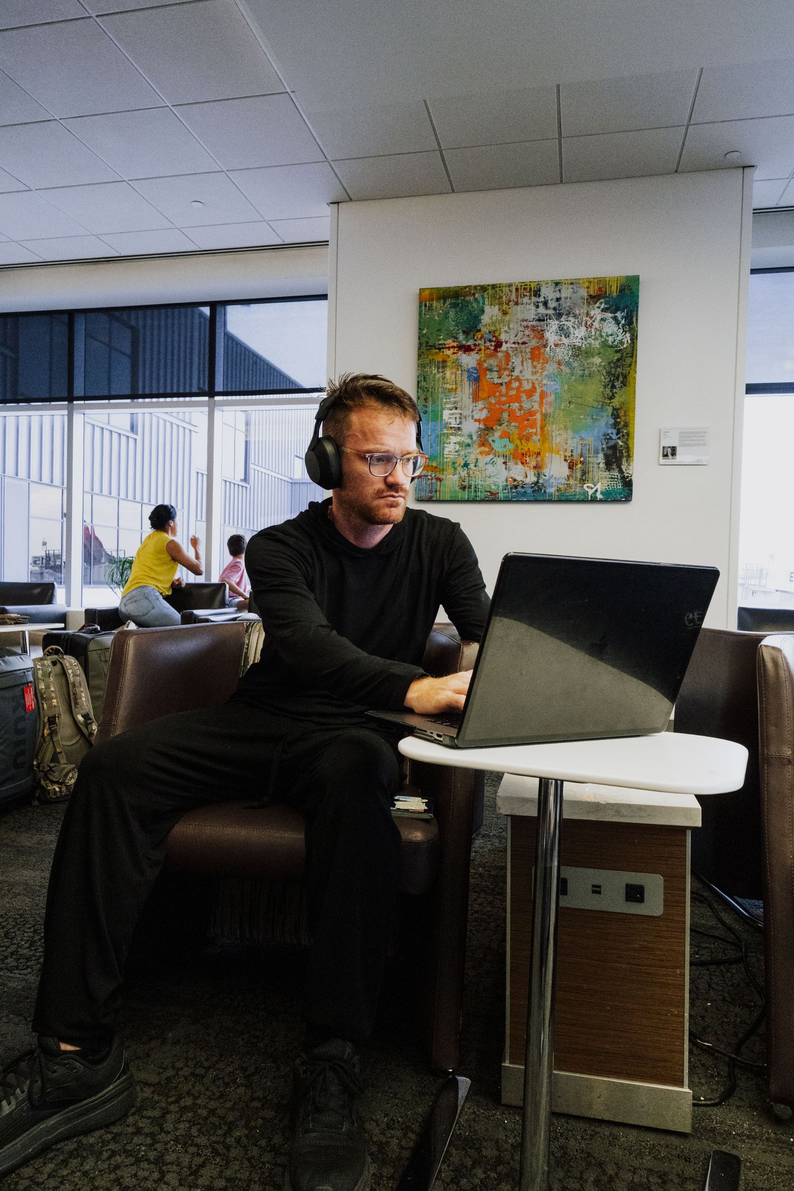 Professional working with technology in an airport environment